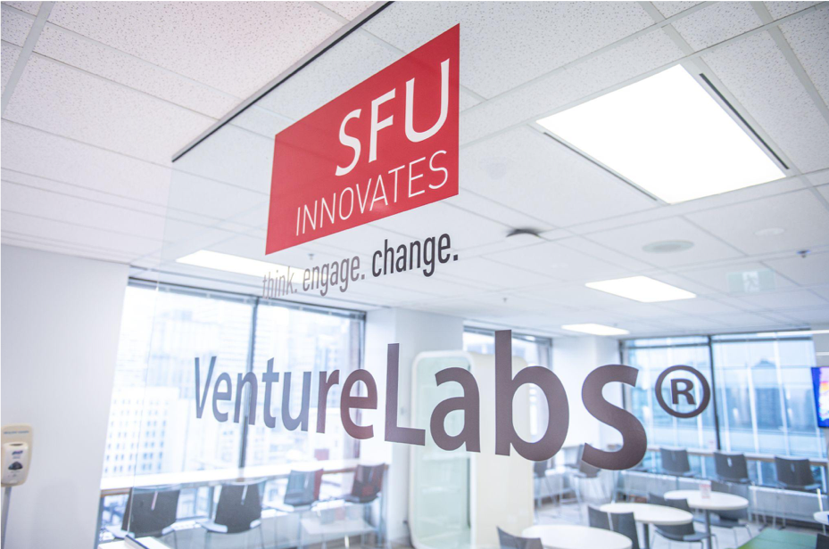 A picture of the SFU VentureLabs logo on a glass wall