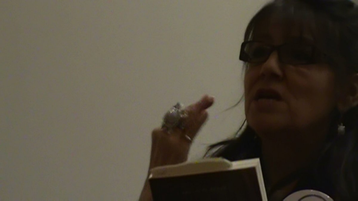 betsy speaking at a Racialized Communities Forum, Douglas College