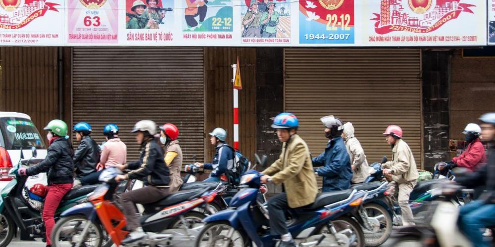 Moving motorcycles on a busy street in Vietnam