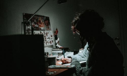 a girl working on a project in the dark