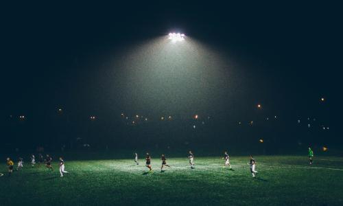 Soccer players playing in the rain