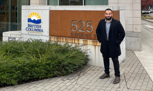 George standing outside, next to a British Columbia sign