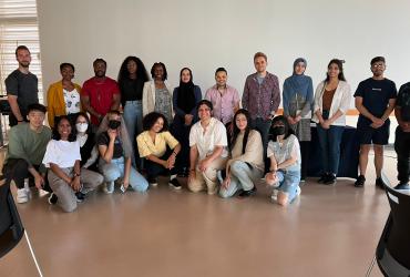 Large group photo of volunteers, guest panelists, and participants at the 2022 World Refugee Event hosted by WUSC SFU Local Committee.