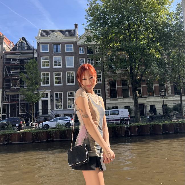 Me standing alongside a canal in central Amsterdam