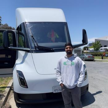 Student in front of a Tesla Semi