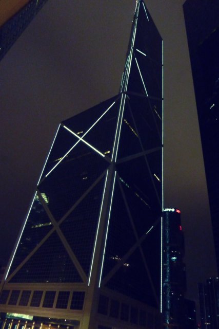 a nighttime image of a beautiful building in the city of Hong Kong