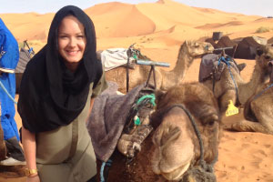 Candice beside a Camel smiling