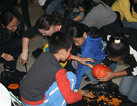 Carlie's students carving pumpkins