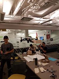 men working on a drone