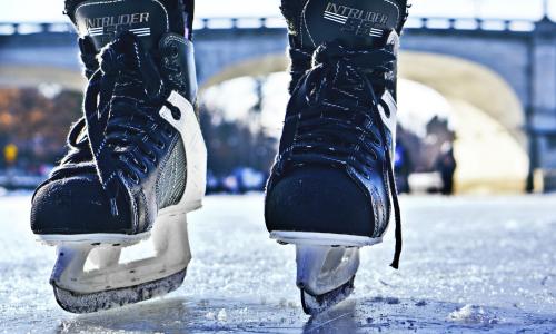 close-up image of a hockey player's skates