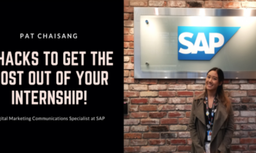 Pat Chaisang standing in front of SAP's sign