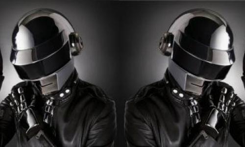 Mirrored image of a person in a helmet and black jacket