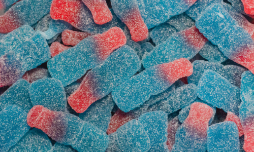 A pile of pink and blue gummy worms. 