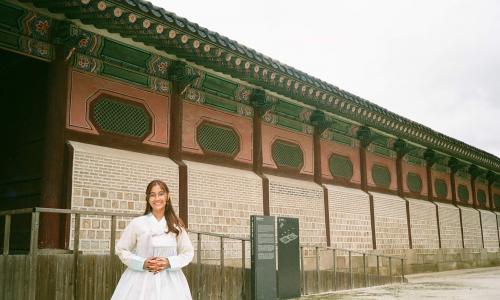 This is a photo of me at Gyeongbukgung, wearing a traditional Korean dress called "Hanbok".