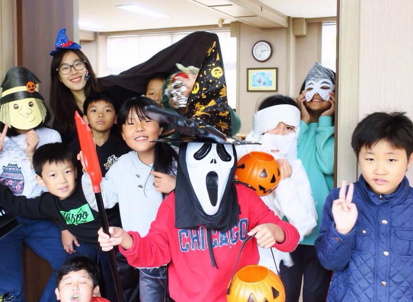 Mila Luong and elementary school students on Halloween 