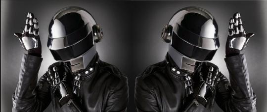 Mirrored image of a person in a helmet and black jacket