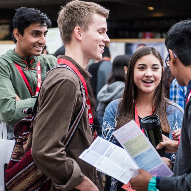 SFU students interacting and networking during the fair
