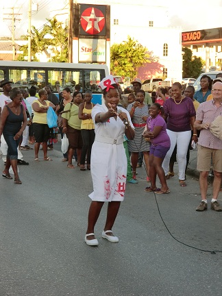 Performer in the street with people in the background