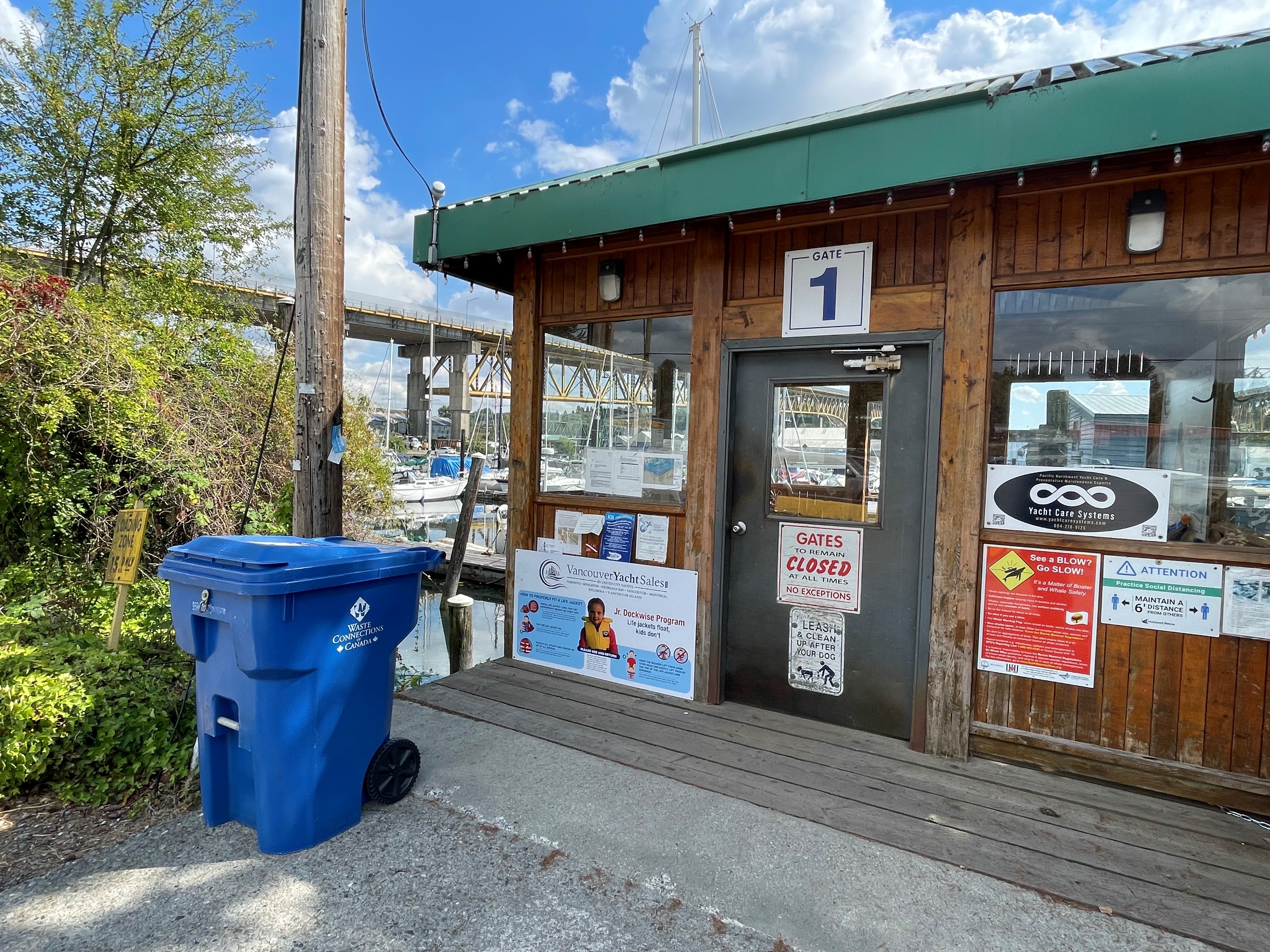 An image of a recycling tote in front of Gate 1 at Lynnwood Marina, as part of the recycling program newly implemented at this Squamish Nation-owned business.