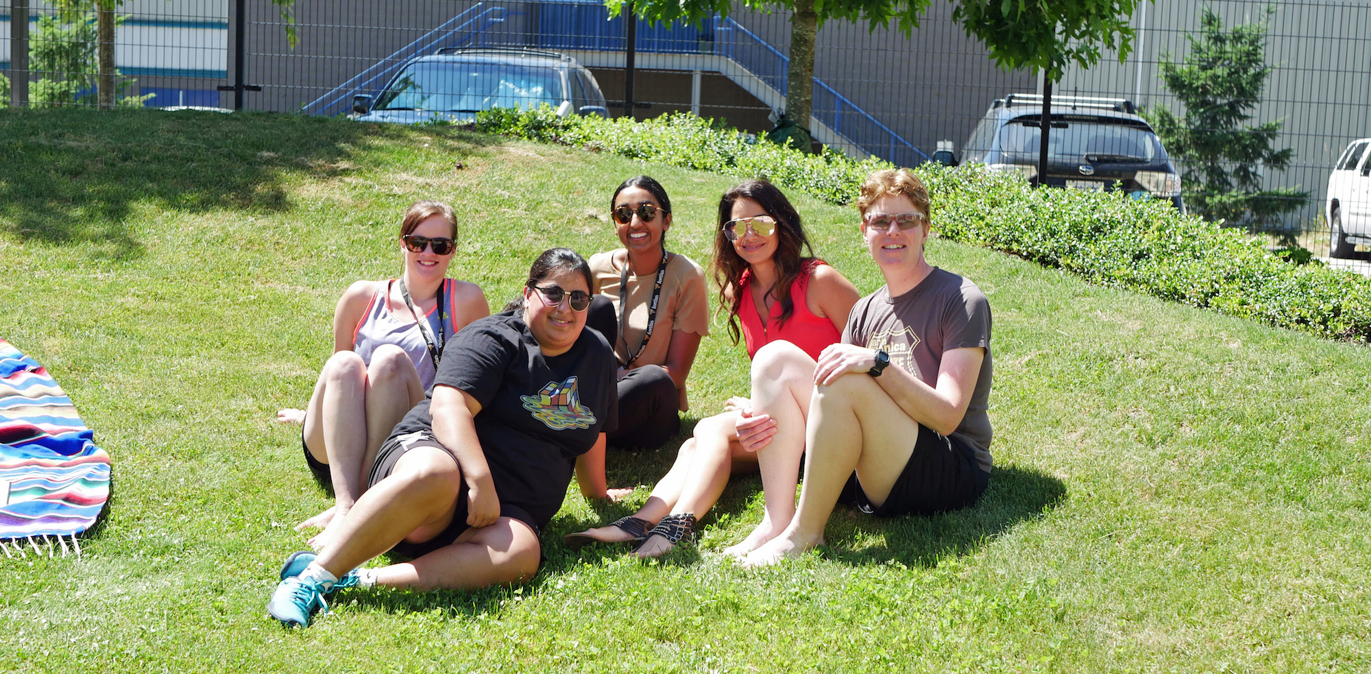 The author and coworkers sitting in a park 