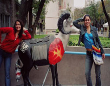photo of Azmeet and peer posing with school mascot, a Ram