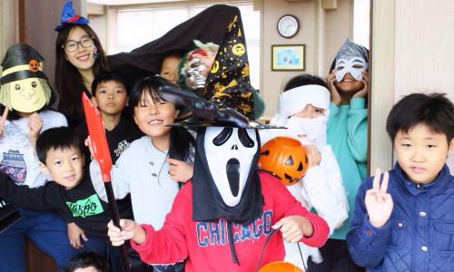 Mila Luong and elementary school students on Halloween 