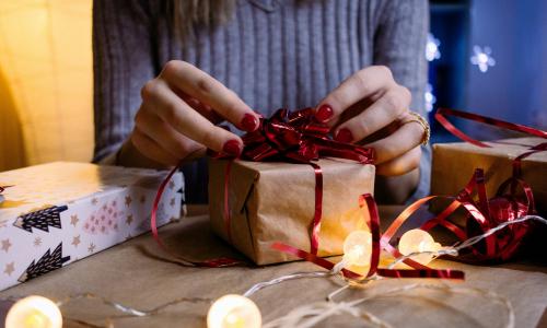 a person gift wrapping