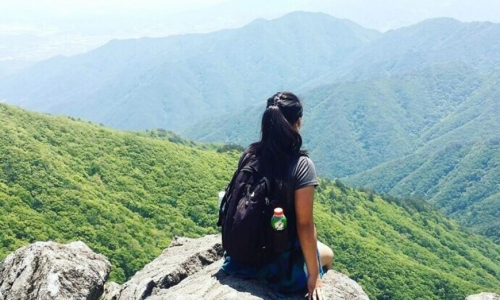 Gloria Lai looking at the mountain view in Hong Kong