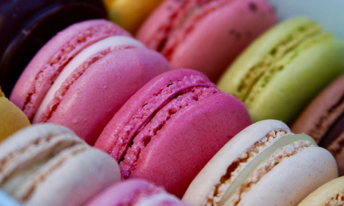 Several colourful macarons in a box