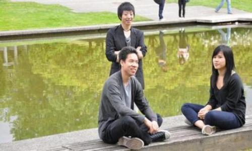Students sitting near SFU Koi pond