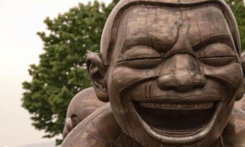 Statue with a laughing face