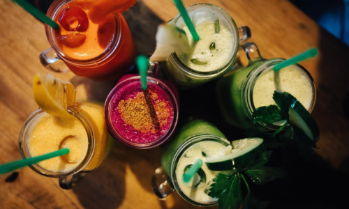 A picture of six smoothies of differing flavours. 