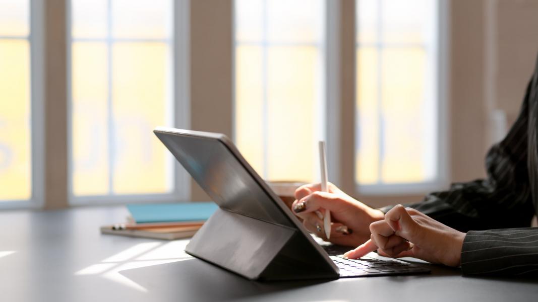 a side way image of someone using a Microsoft surface