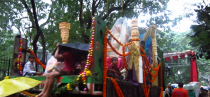 Children sitting on a fully decorated float