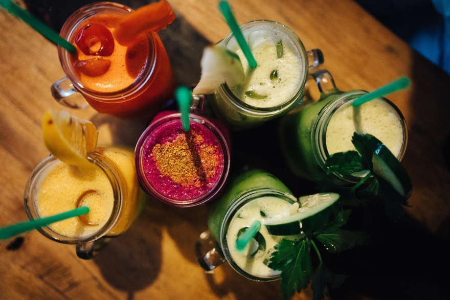 A picture of six smoothies of differing flavours. 
