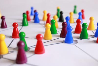 Representation of Networking - clusters of multicoloured board game pieces