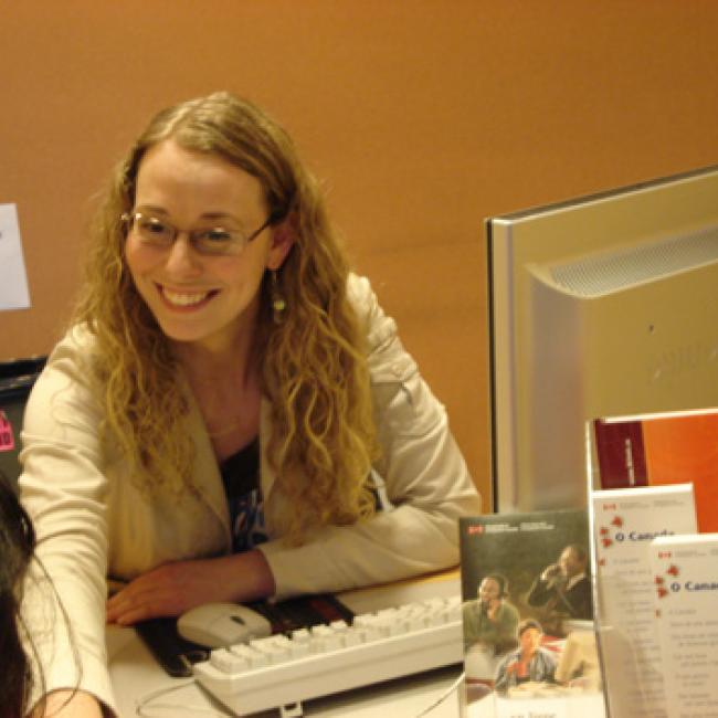 Suzanne smiling at her desk