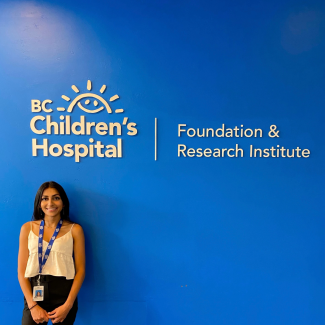 Shreya Luthra standing under the BC Children's Hospital sign.