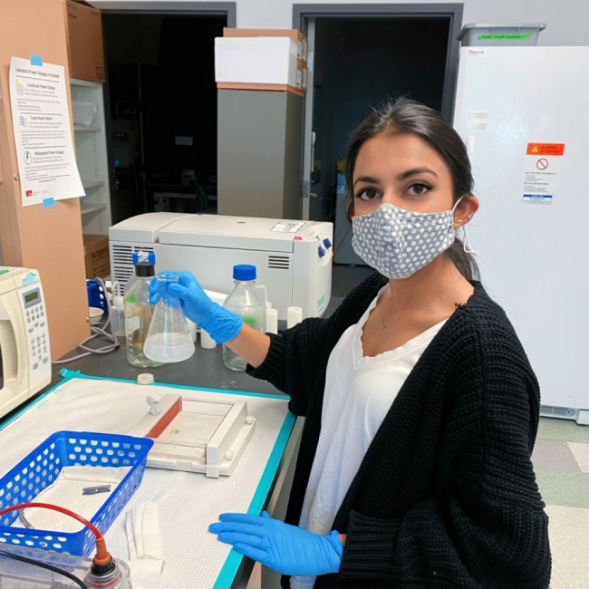 Shreya Luthra working in a lab.