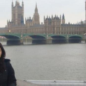 Sanaz smiling in front of Big Ben in London