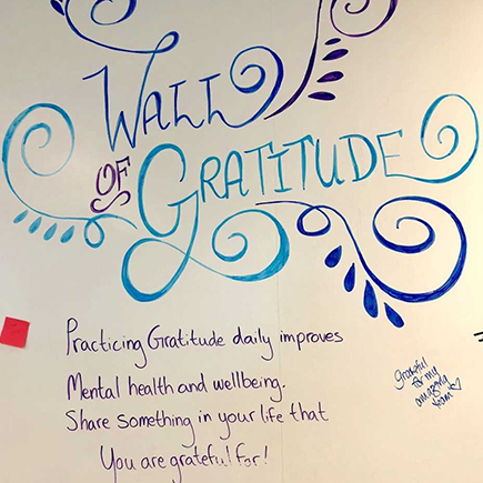 a whiteboard with items listed under "wall of gratitude"