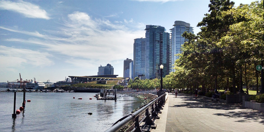 a snapshot of the ocean and highrises by the seawall in downtown Vancouver