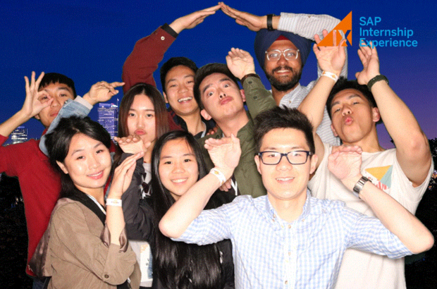 A group of SAP Interns smiling and posing in front of a virtual background 