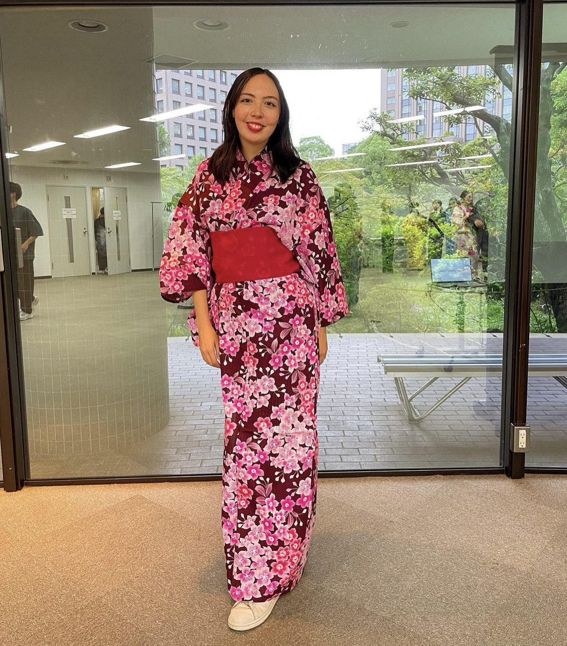 Aoife wearing a yukata with a pink floral design