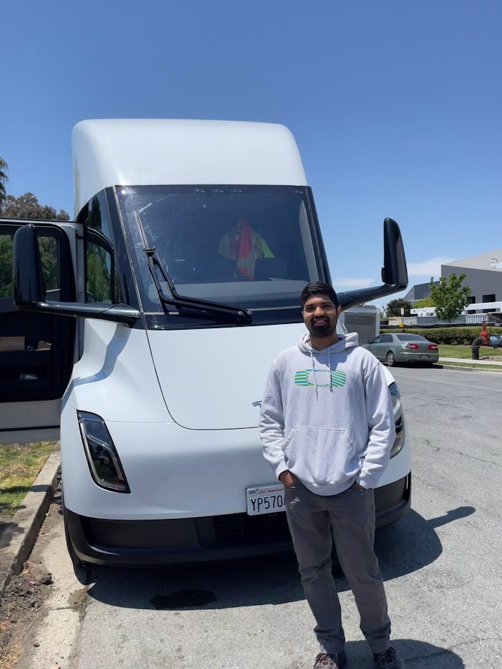 Student in front of a Tesla Semi