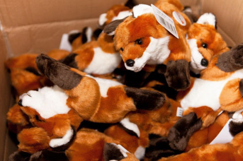 Box of stuffed animal foxes