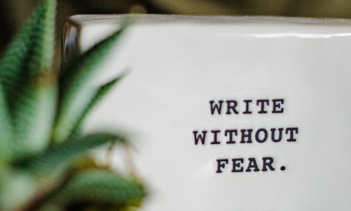 A ceramic block with the words "Write Without Fear" printed ontop