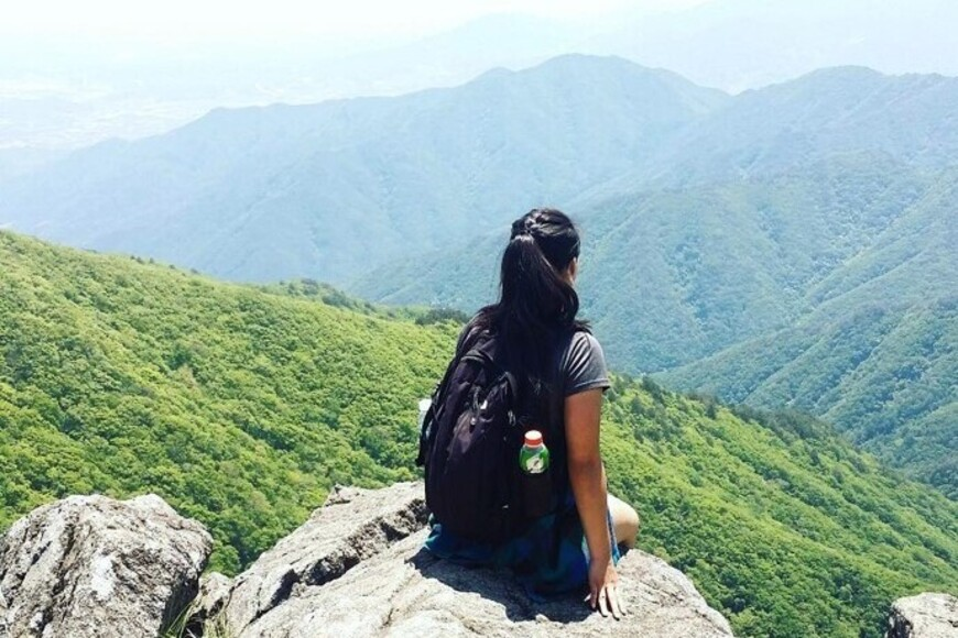 Gloria Lai looking at the mountain view in Hong Kong