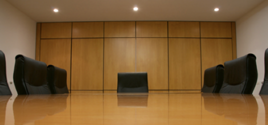 conference table with empty chairs
