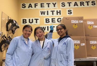 My trainer and my co-worker showing that safety begins with us when working in a lab. 